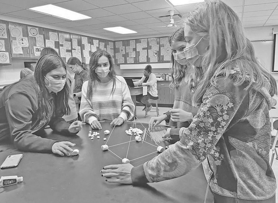 Ally DeLatorre 23, Lauren Schinker 23, Malia Fink 23, and Peri Deroche 23 at GEMS club meeting (GEMS Instagram).