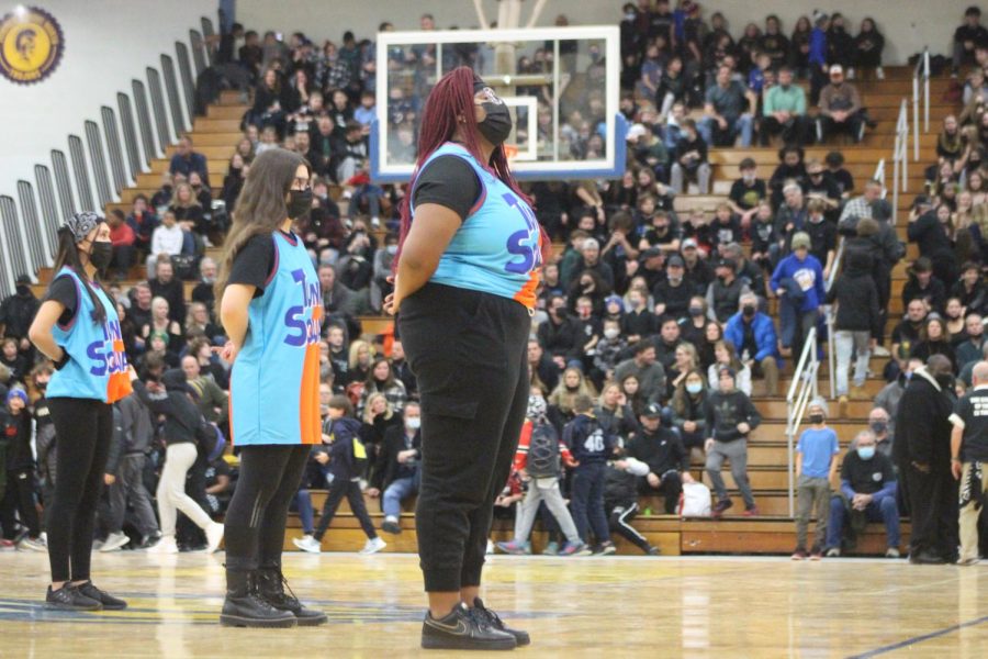 Careena Jaurez ‘22, Paula Soares ‘22, and Abena Yeboah ‘22 do the stepping routine at the blackout game (Wolf/LION).
