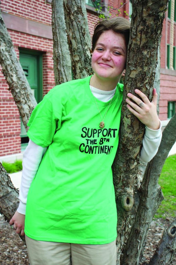 Aimee Rounds 22 poses in a T-shirt made to fund the tree planting and pollinator garden (photo courtesy of Patrick Page).
