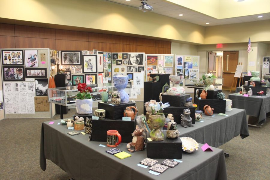 Table featuring an array of ceramics created by different art class levels (Race/LION).