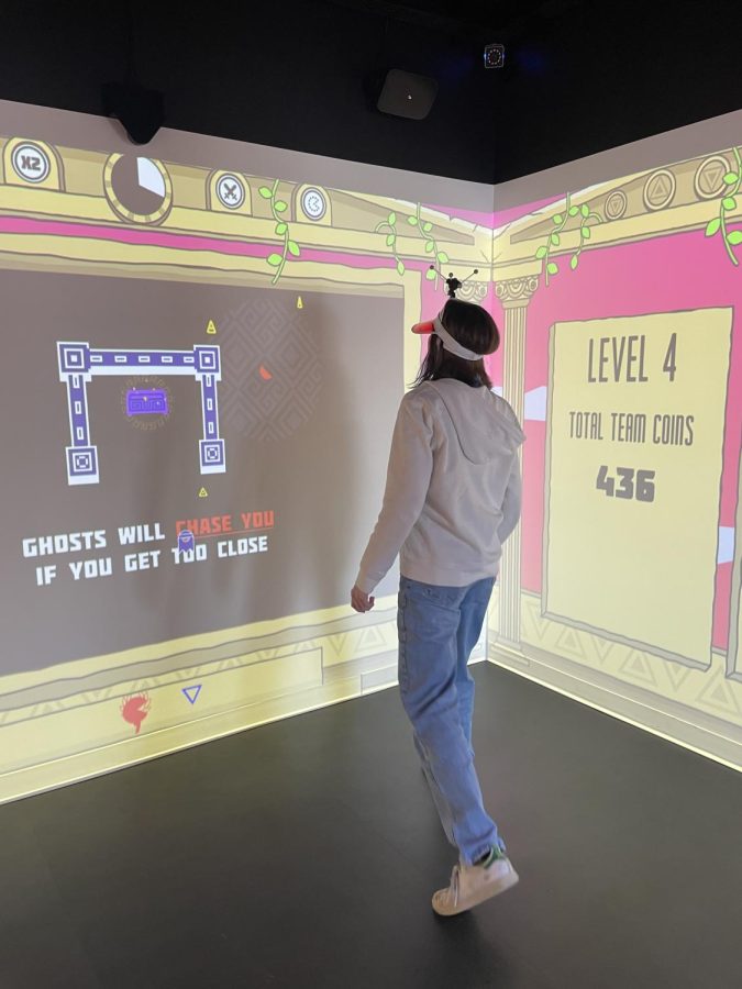 Natalie Kornfiend '23 playing interactive Electric Gamebox game, 