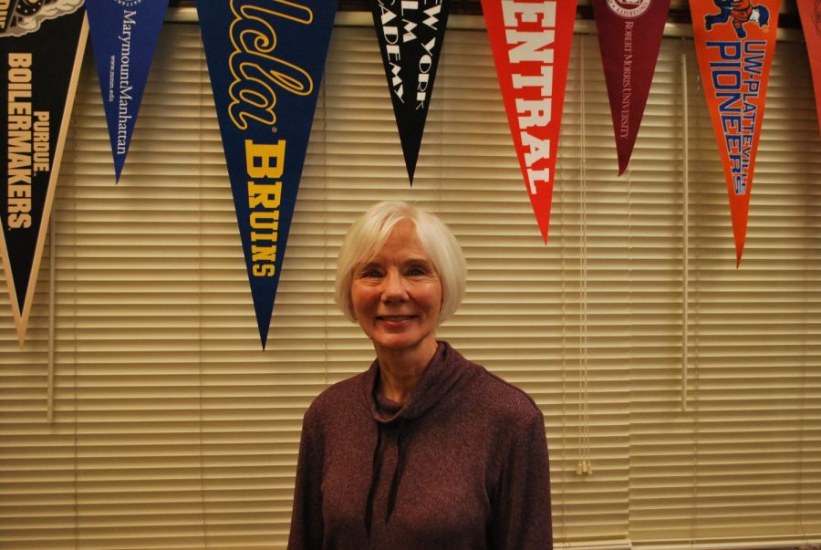 Lianne Musser poses in the College/Career Center, where she has worked for 16 years, on April 19 (Mosqueda/LION).