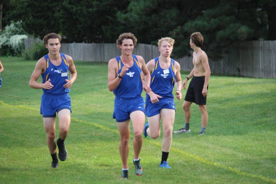 Finn Murrary 23, Joey Hermann 23, Hudson Wulff 24 use pack running strategy through race on Sept. 15th at SC fields (Burke/LION).