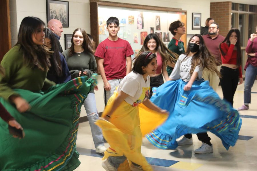 Members of the Latin dance group dance in a hallway at NC while wearing traditional Latin dance wear at the meeting taking place on Nov. 30 after school (Moran/LION).