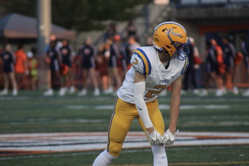 Wide receiver Travis Stamm 24 locks into game against Oak Park River Forest High School on Sept. 16. LT won the game 38-13 (photo courtesy of Bruederle)