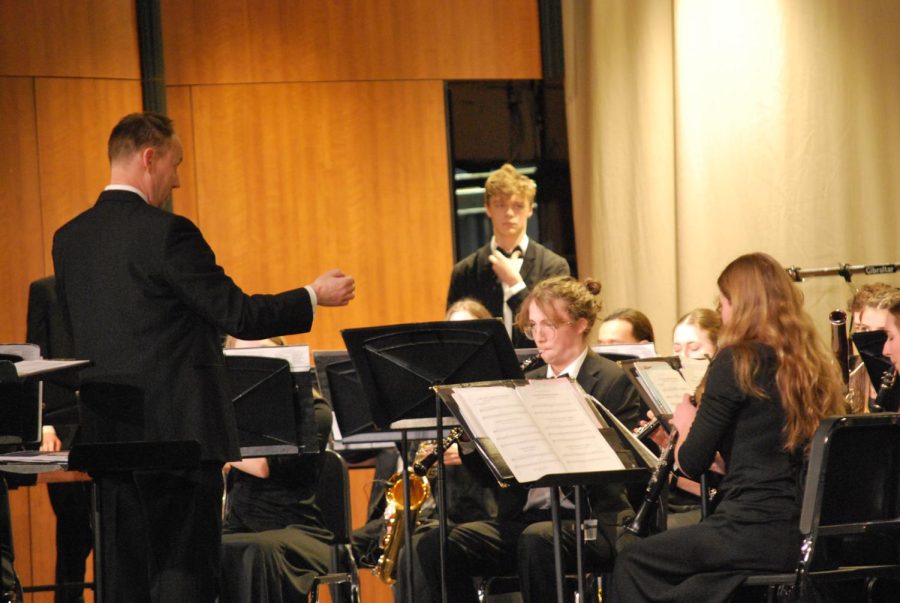 Band director Mark Dahl conducts the Wind Ensemble in playing ‘Awayday’ in NC Reber Center on Feb. 2 (Davis/LION). 