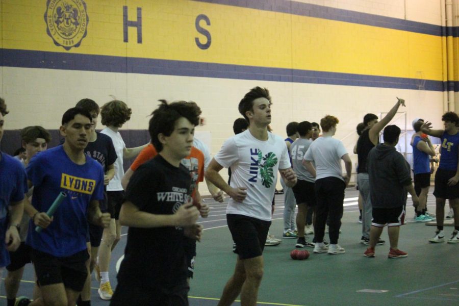 Michael McGuire 24 and Vlad Vukas 23 run laps with their teammates at practice in the SC fieldhouse on Jan. 22 (Ruppert/LION)