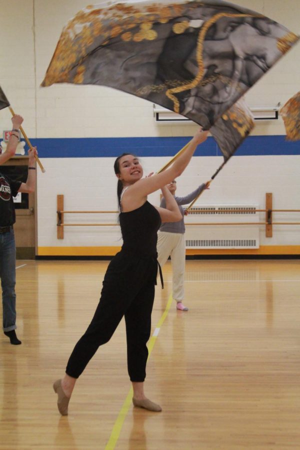 Calla Montana 23 practices her Color guard routine at NC with teammates. Montana qualified for State earlier in February (Pohl/LION).