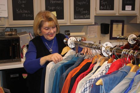  Hope Chest volunteer organizes clothing for the upcoming Spring collection (Kowalski/LION). 
