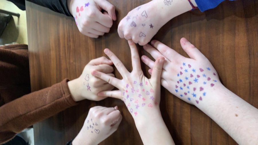 The hands of multiple LT students with hearts and stars drawn on them who participated in the MOXIE quiet movement on April 10, 2023. 
(photo courtesy of @moxie_kids7) 