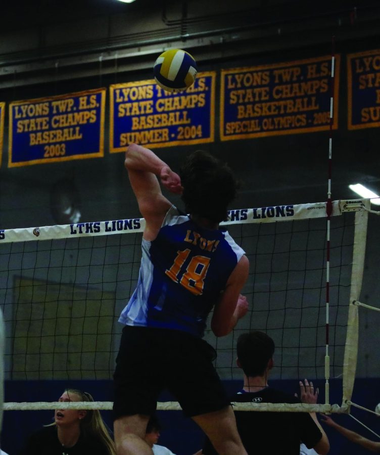 Tim Shepard warms-up before home game against Oak Park River Forest High School on April 11 (Garrity/LION).