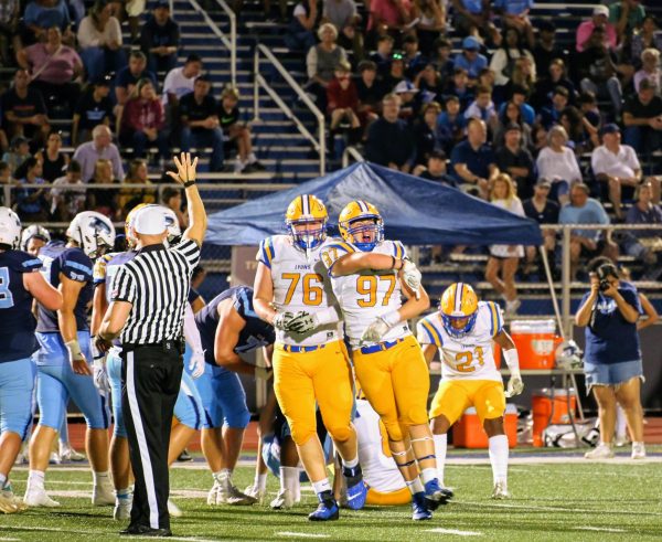 Roman Sosnovy ‘26 and Tyler Chambers ‘25 celebrate after sacking the Quarterback (Klos/LION)