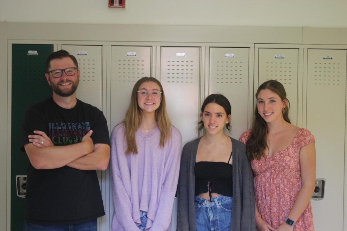 From left to right, Joseph Maffey stands alongside Sydney Matysik ‘24, Nina Ivancevic ‘24, and Josie Menna ‘24 (Davis/LION). 