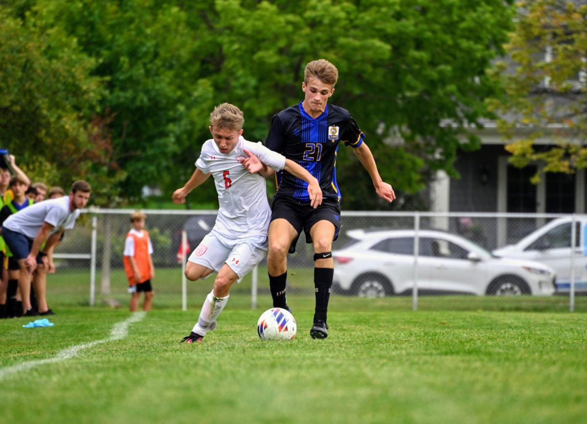 Zach Morgan 24 fighting for ball during game against Stagg High School at NC Fields on Sept. 7 (Klos/LION). 