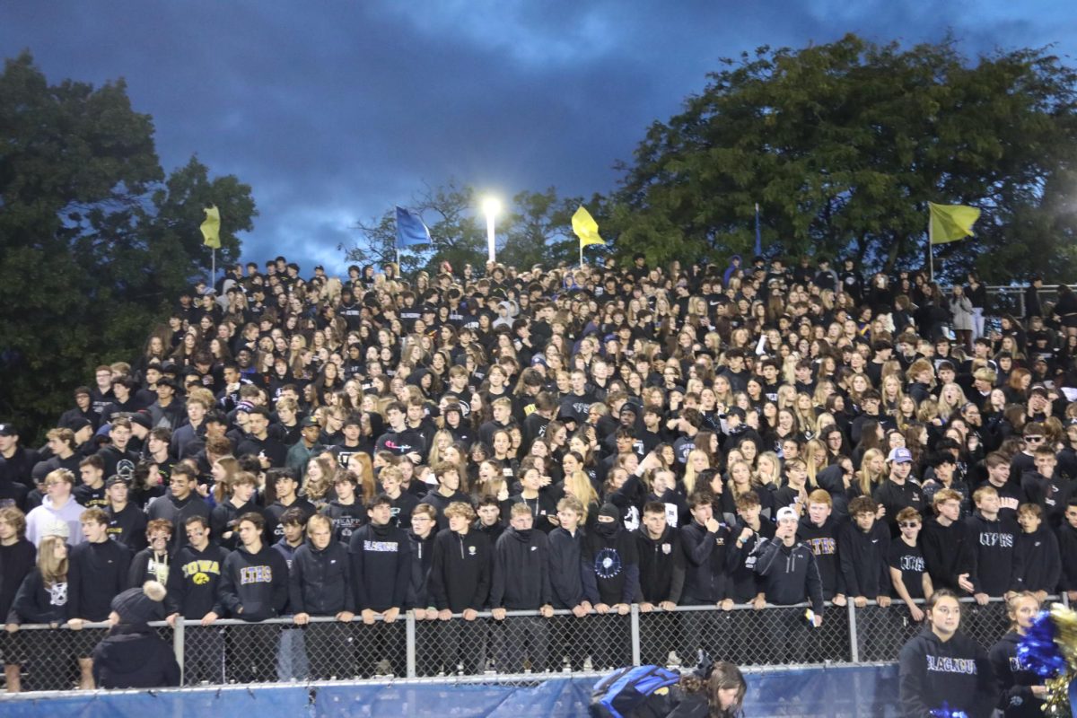 Football game student section participate in Lions Den game theme ‘black out’ on Oct. 6. 