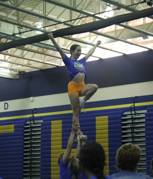 Competitive cheer works on routine for state