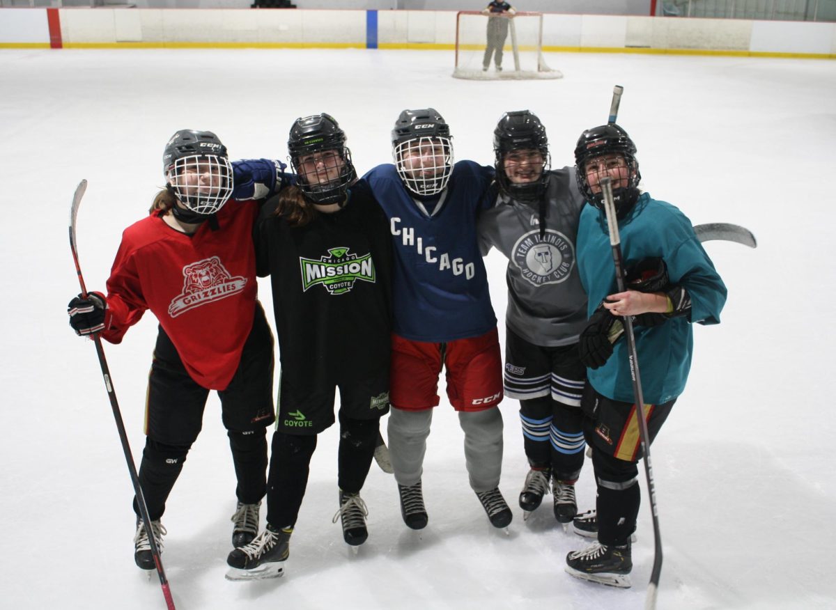 LT players come together after Thursday practice on Nov. 30 at Downers Grove Ice Arena (Garrity/LION).