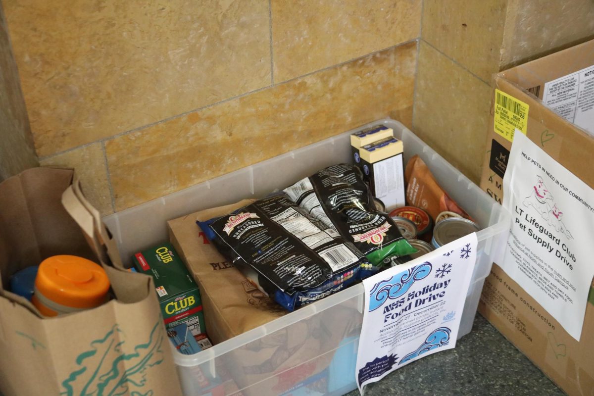 Collection bins full of donations in the NC clocktower main entrance (Ludden/LION). 
