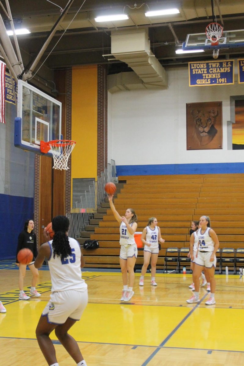 Gwen Smith ‘26 takes a shot at a home game on Nov. 18 against Conant High School. 
