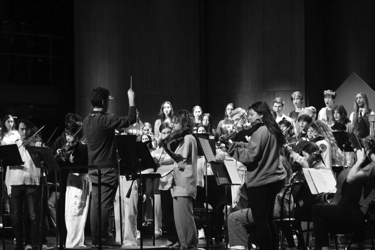 Director Jan Matthew conducts the orchestra during the FanFares and Carols Concert rehearsal in the Reber Center on Nov. 30th (O'Brien/LION).