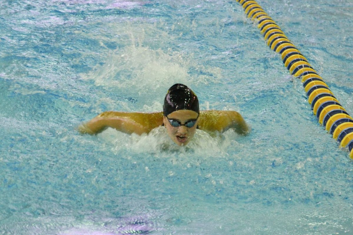  Elizabeth Baum ‘24 enters the final stretch of her race while competing in the butterfly (Photo courtesy of Chuck Baum).

