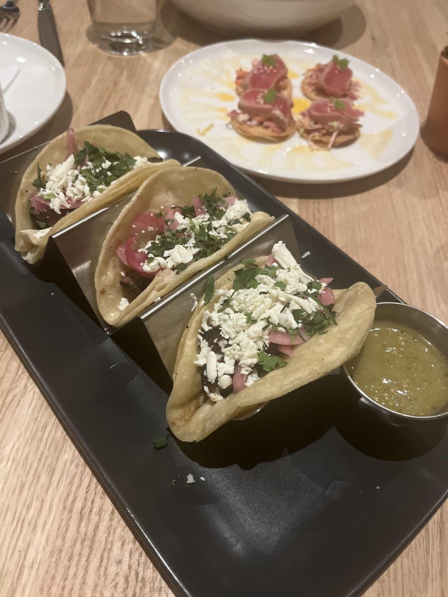 The main serving three Carne Asada Tacos with a side of green sauce (DAntonio/LION). 