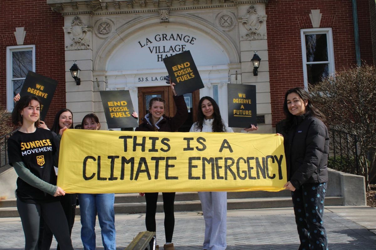 Rally+participants+hold+climate+emergency+banner+at+La+grange+Village+Hall%0ASunrise+Movement+holds+rally+%28photo+courtesy+of+Riley+McCarthy%29.+%0A