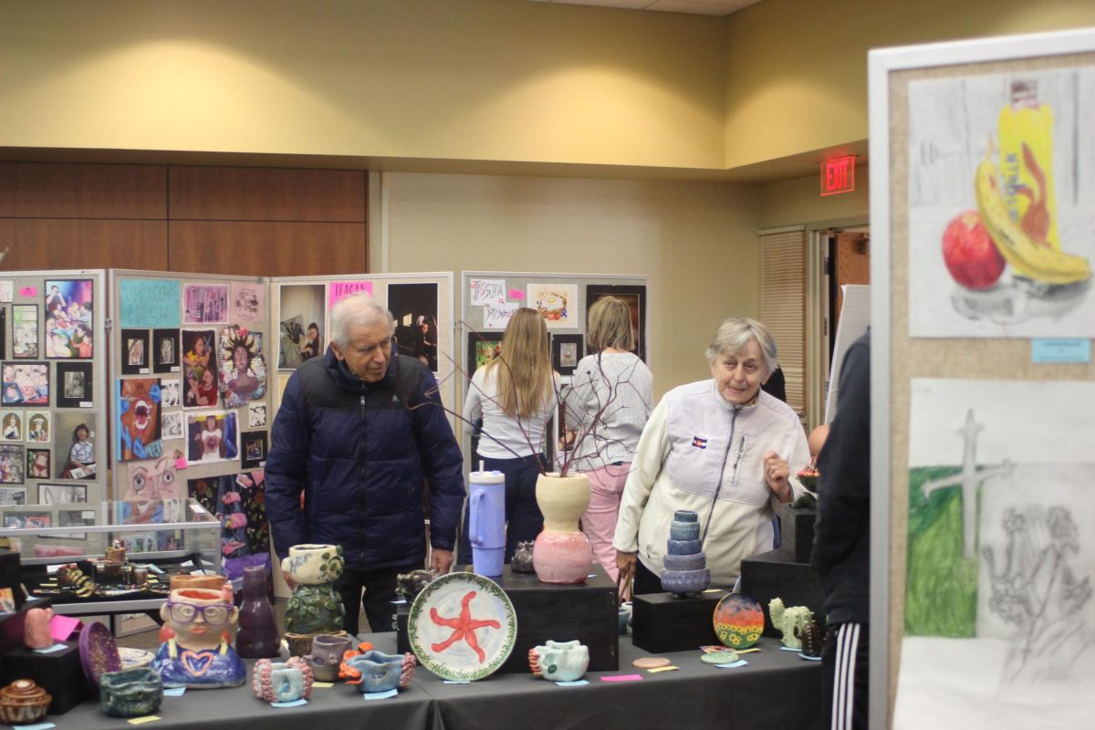 Friends and family members gather to view student artwork (Kowalski/LION).