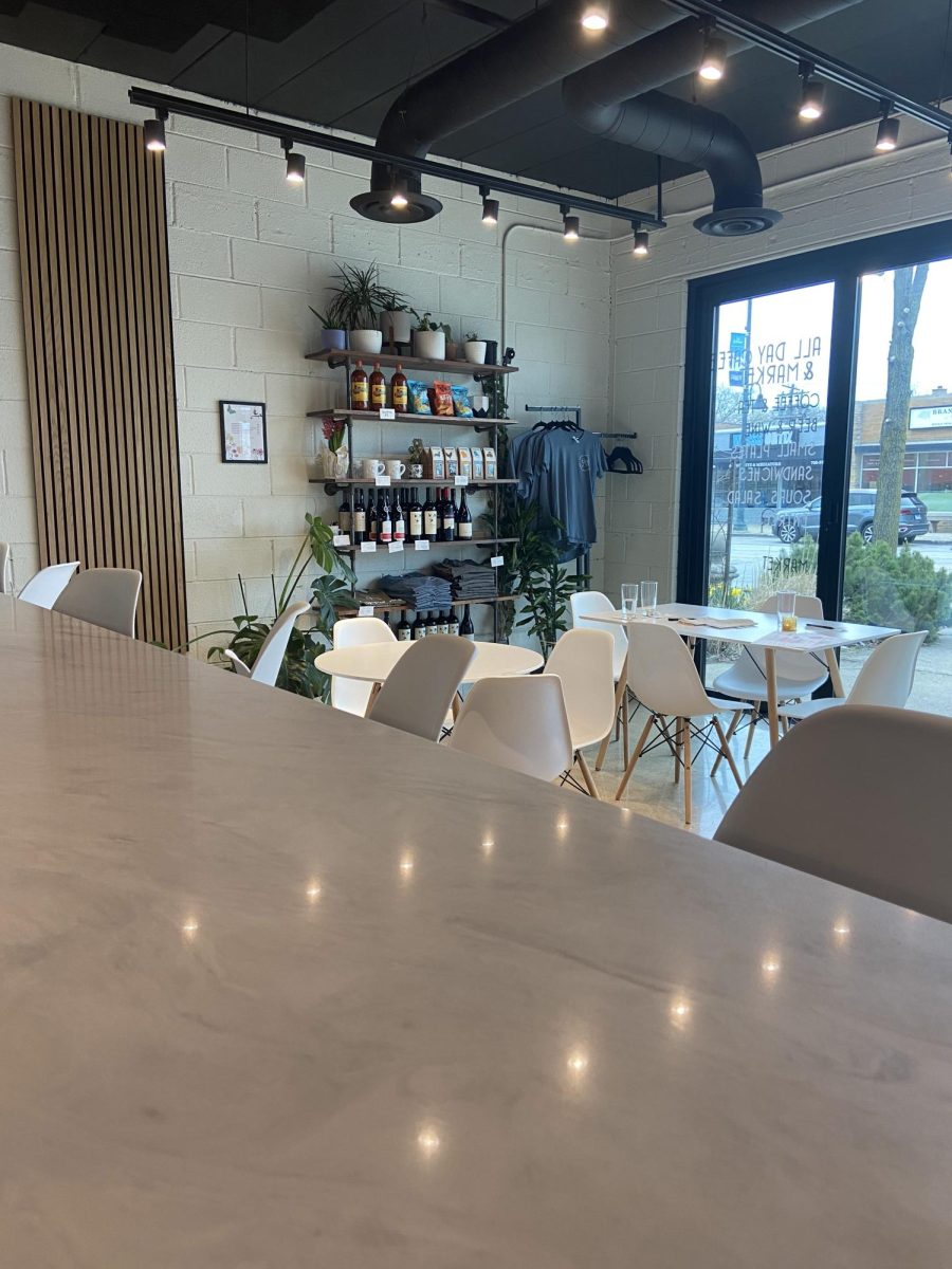 Interior layout and seating inside of Happier Now Cafe and Market (Ruppert/LION). 