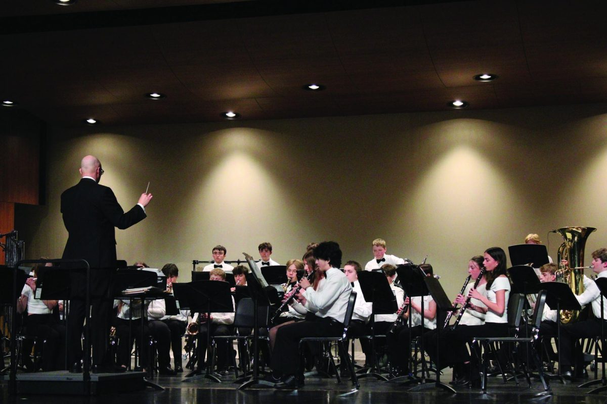 Photo caption: Band students perform on stage in the Reber Center during the Spring Concert on April 16
