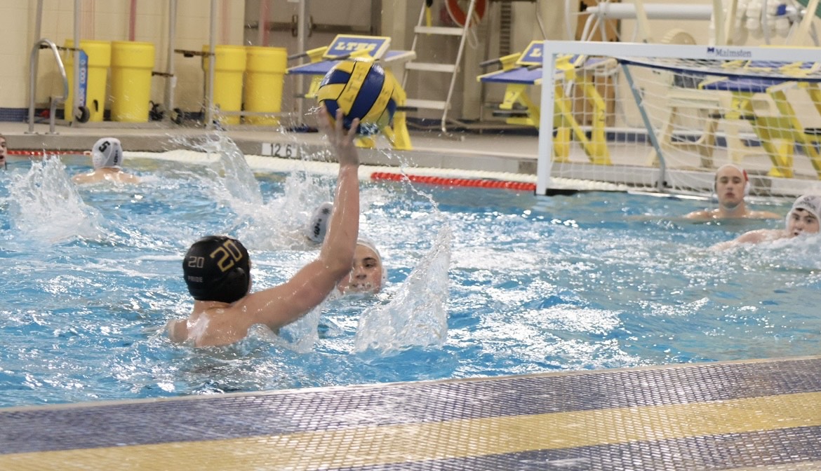 Wesley Musgrove '26 shoots the ball towards the net during the team's game against Hinsdale Central on April 26 (courtesy of Brooke Stack).