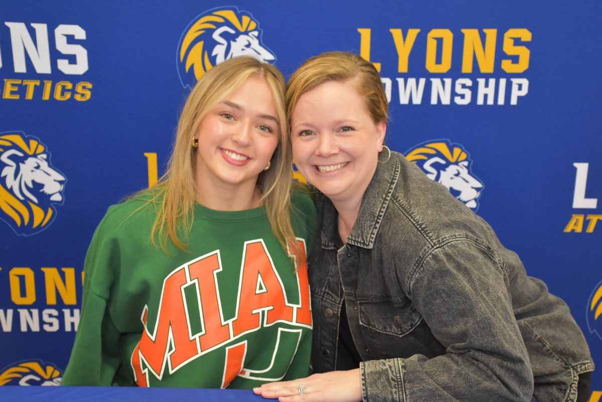 Brooke Walsh ‘25 poses with her mother as she signs to the University of Miami (photo courtesy of John Grundke).