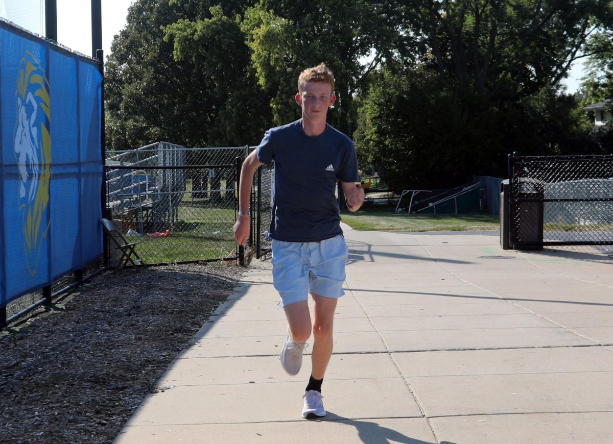 Isaac Phillips ‘27 runs throughout the neighborhood for practice on Sept. 16 (Brooks/LION). 