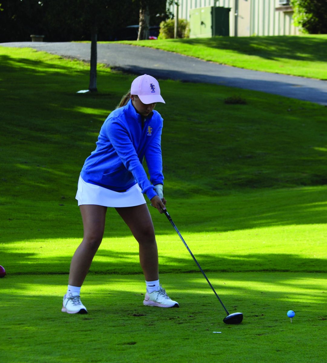 Amelia VanVuren ‘26 readies her swing on Sept. 4 at Flagg Creek golf course (Brooks/LION).