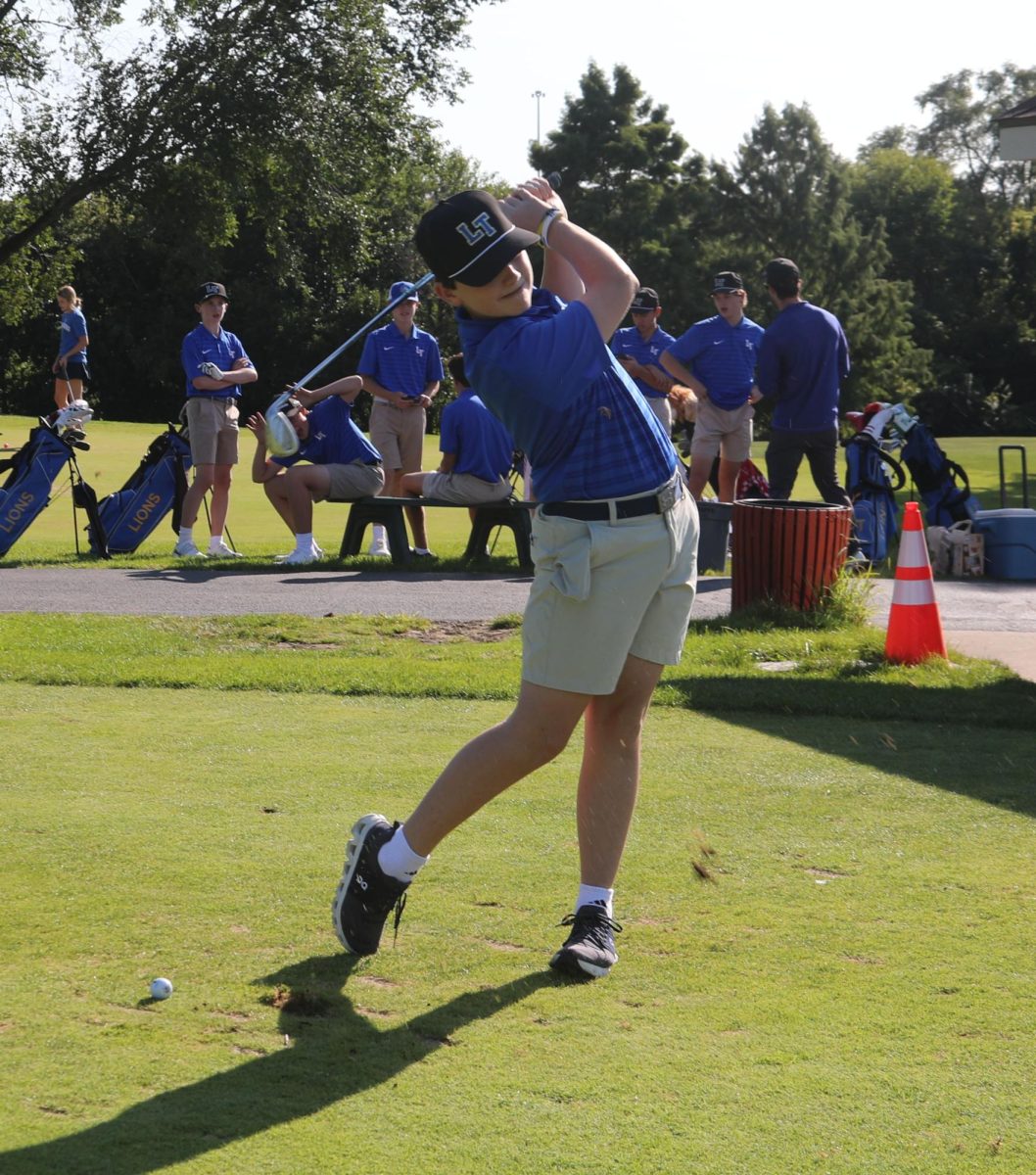 Colin Cassidy ‘28 takes a swing at practice on Sept. 8 at Flagg Creek golf course. (Brooks/LION).
