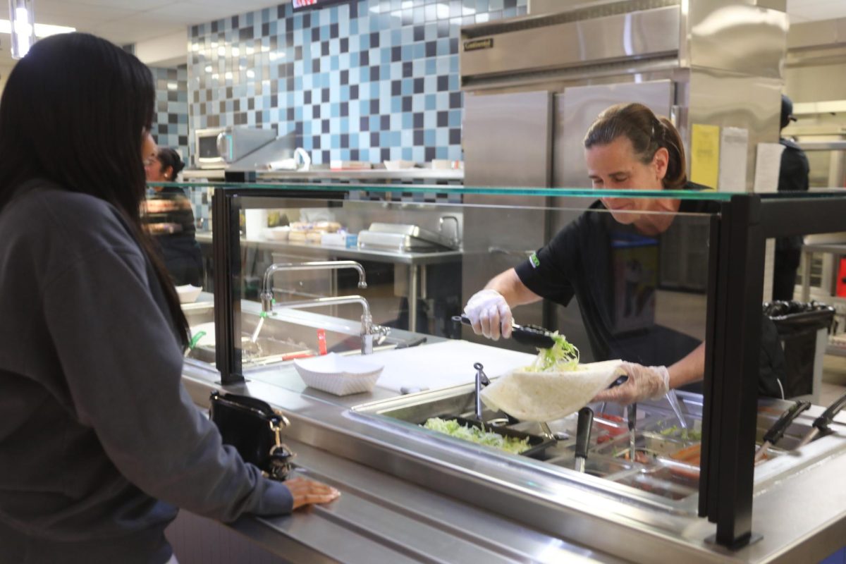 Food being made by employee in the North Campus Cafeteria (Stack/LION).
