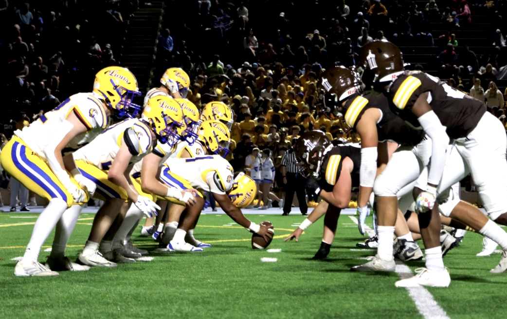 Lions face off against Joliet Catholic on Aug. 29 under the roar of the enthusiastic crowd for the win (Stack/LION).