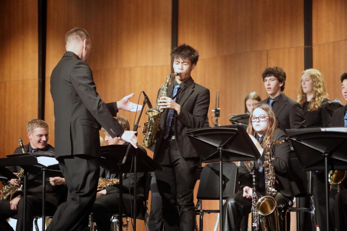 Jonas Magpayo ‘26 plays saxophone solo in show on Oct. 9 (Simmons/LION).