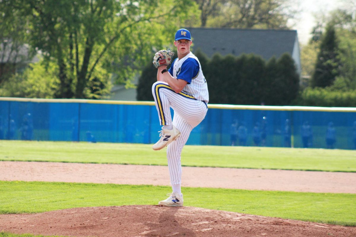 Jack Slightom ‘26 pitches a fastball to Glenbard West (Simmons/LION).