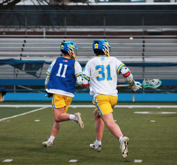 The attackers, Lawson Krueger '26 and Colton Miller ‘29, run together planning their next attack on the OPRF Huskies (Simmons/LION). 