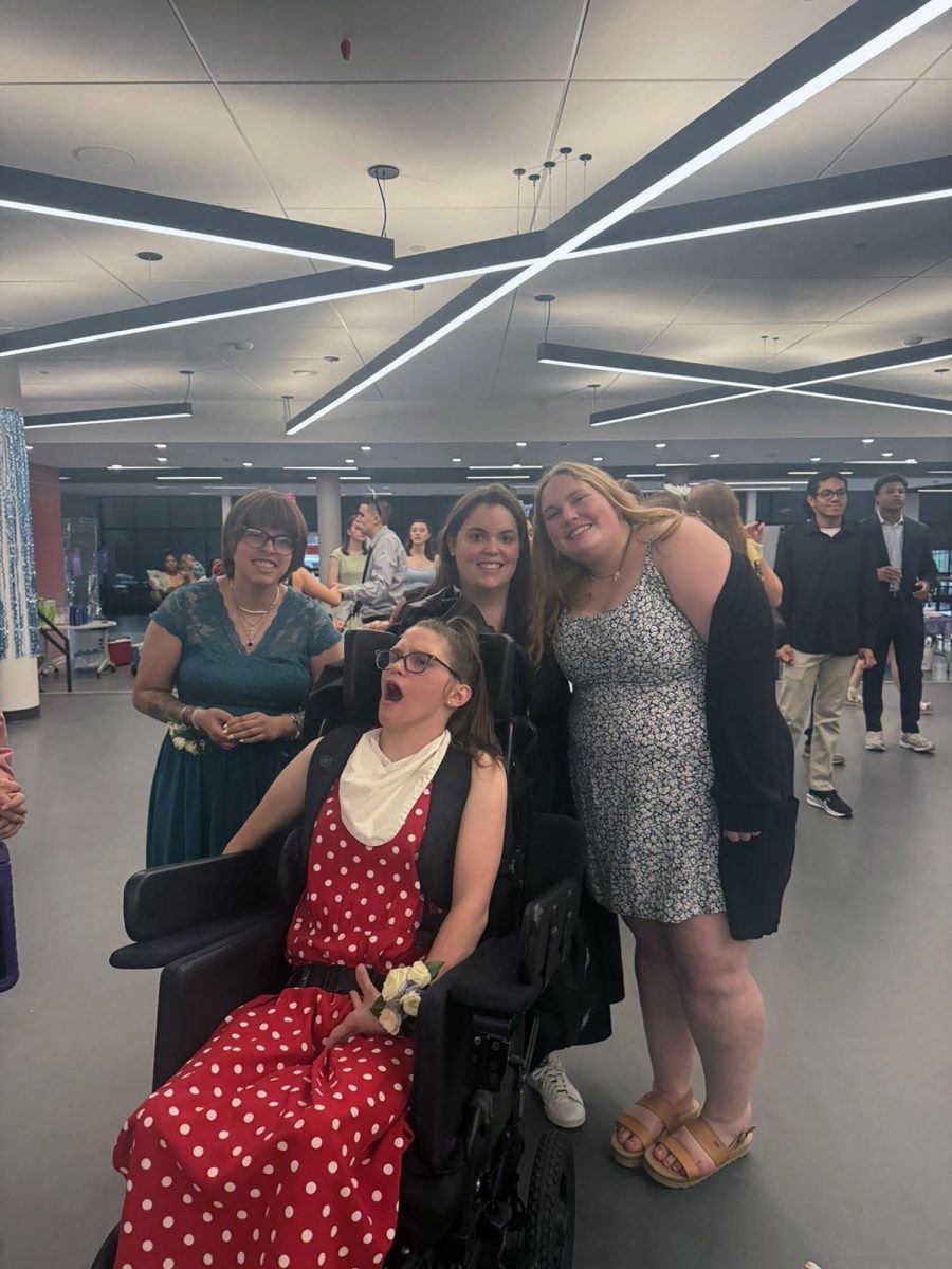 From left to right: Somyra Lvin ‘23, Macie Burek ‘23, Evie Ormsby ‘25, Erin Busby ‘26 smile for picture at prom (Stack/LION).