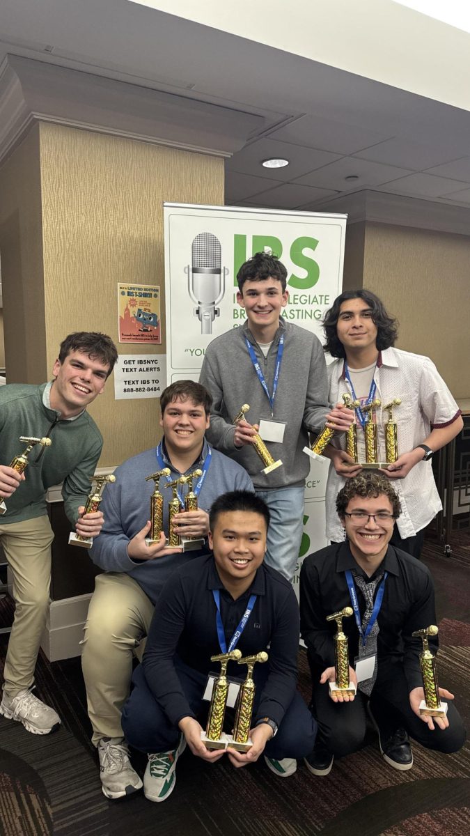 Winners gather after awards ceremony posing with their trophies (photo courtesy of Chris Thomas).
