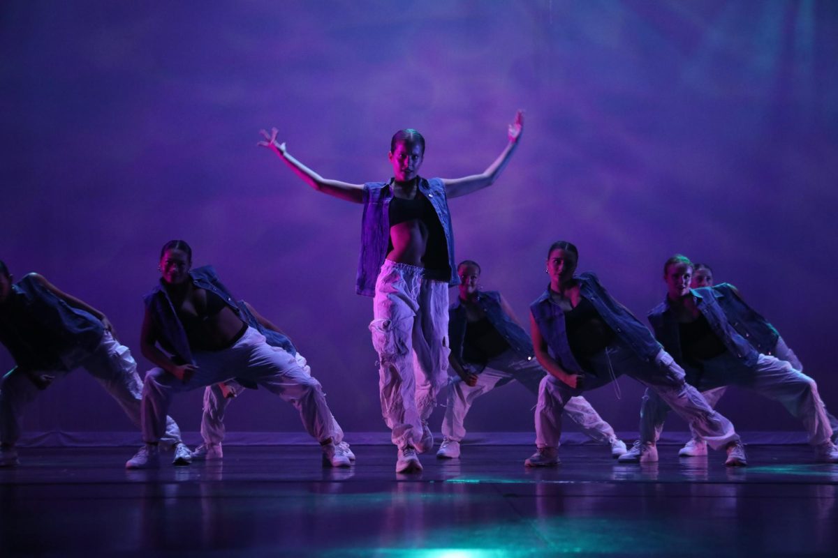 Greta Newlin throws her arms up during a hip hop number at the dress rehearsal on May 4 in the NC Reber (Brooks/LION).