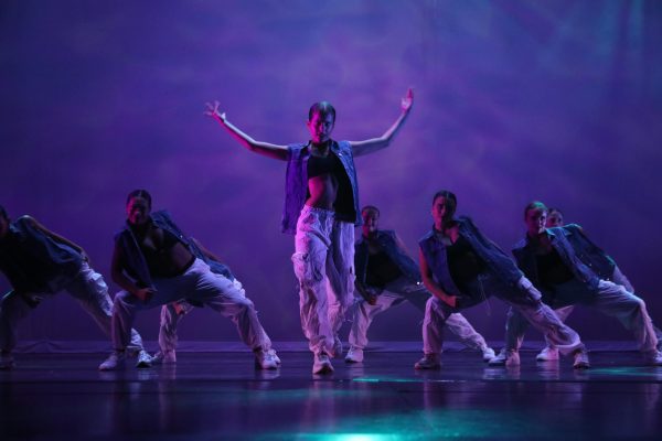 Greta Newlin throws her arms up during a hip hop number at the dress rehearsal on May 4 in the NC Reber (Brooks/LION).